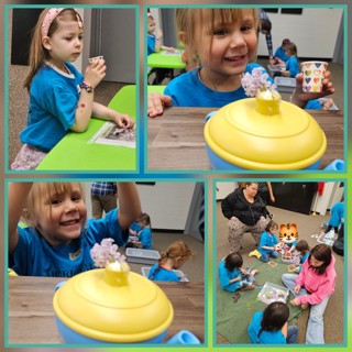Children in the classroom exploring a hands-on activity together at the table.