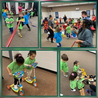 Children riding scooters and playing with staff in the gym.